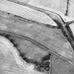 Oblique aerial view centred on the cropmarks of the E ring-ditch, taken from the SSE.