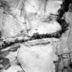 Oblique aerial view of Loss Burn centred on the remains of a farmstead, park and rig with an archaeological landscape adjacent, taken from the WNW.