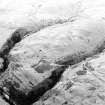 Oblique aerial view of Third Inchna Burn centred on an archaeological landscape, taken from the SSE.