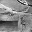 Oblique aerial view centred on the soilmarks of the Roman fortlet, taken from the ESE.