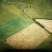 Oblique aerial view centred on the cropmarks of the Roman temporary camp, taken from the WSW.