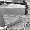 Castledykes Roman Temporary Camps, oblique aerial view, taken from the N, centred on the cropmarks of a camp, which is also visible, with another camp, in the top half of the photograph.