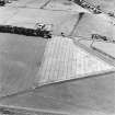 Castledykes Roman Temporary Camp, oblique aerial view, taken from the E, centred on the cropmarks of NE corner of the camp.