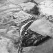 Haywood, Droveloan and Greenbank, oblique aerial view, taken from the E, showing Haywood village with the remains of miners' rows and a farmstead in the centre of the photograph, a cottage and the two bings of a coal mine adjacent to the dismantled railway in the bottom centre, and areas of rig beside Droveloan cottage in the bottom left-hand corner, and Greenbank in the top left-hand corner.