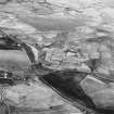 Haywood, Droveloan and Greenbank, oblique aerial view, taken from the NNW, showing Haywood village with the remains of miners' rows and a farmstead in the centre of the photograph, two bings of a coal mine adjacent to the dismantled railway in the left centre, and areas of rig at Droveloan cottage in the top half, and Greenbank in the right.