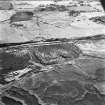 Greenrigg Colliery, oblique aerial view, taken from the S, showing the spoil heaps of the coal mine across the centre of the photograph.