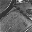 West Lindsaylands, oblique aerial view, taken from the ENE, showing the cropmark of a fort in the centre of the photograph.