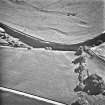 West Lindsaylands, oblique aerial view, taken from the N, centred on the cropmarks of a fort or causewayed enclosure.