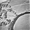 West Lindsaylands, oblique aerial view, taken from the SW, centred on the cropmarks of a fort or causewayed enclosure.