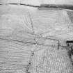 Morton Hill and Cowthrople, oblique aerial view, taken from the NNW, showing an area of rig and furrow cultivation across the photograph, and a ruined farmstead at the centre right edge.