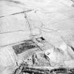 Morton Hill and Cowthrople, oblique aerial view, taken from the W, showing an area of rig and furrow cultivation across the photograph, and a ruined farmstead in the centre.