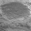 Cobbinshaw, oblique aerial view, taken from the WNW, showing a section of the Tarbrax Branch of the Caledonian Railway running across the top of the photograph.