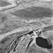 Cobbinshaw, oblique aerial view, taken from the SSW, showing a section of the Tarbrax Branch of the Caledonian Railway running across the bottom half of the photograph, passing between South Cobbinshaw coal mine in the centre, and brick works in the bottom right-hand corner.