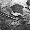 Viewfield Shale Pit, oblique aerial view, taken from the N,showing the shale-oil mine in the centre of the photograph, with the junction of the two lines of the Tarbrax Branch of the Caledonian Railway in the bottom half.