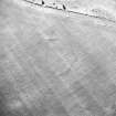 Oblique aerial view centred on the cropmarks of the settlement with fort adjacent, taken from the WNW.