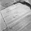 Oblique aerial view centred on the cropmarks of a possible settlement, taken from the ESE.