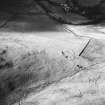 Kirkton Burn, oblique aerial view, taken from the SE, centred on two scooped settlements amidst cultivation remains.