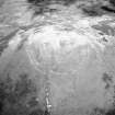 White Meldon, oblique aerial view, taken from the S, centred on the fort and a cairn.