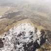 White Meldon, oblique aerial view, taken from the N, centred on the fort and a cairn.