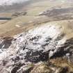 White Meldon, oblique aerial view, taken from the NNW, centred on the fort and a cairn.