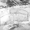 Oblique aerial view centred on the remains of the farmstead, rig, enclosures and quarry, taken from the NNW.