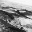 Oblique aerial view centred on the remains of rig and field banks towards the city of Edinburgh, taken from the ESE.