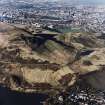 Oblique aerial view of Holyrood Park centred on the remains of cultivation terraces and rig, taken from the SE.