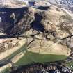 Oblique aerial view of Holyrood Park centred on Arthur's Seat with the remains of cultivation in front, taken from the SW.
