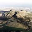 Oblique aerial view of Edinburgh, Holyrood Park centred on the remains of cultivation terraces and Arthur's Seat, taken from the WSW.