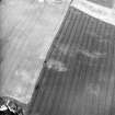 Dalachy Quarry, oblique aerial view, taken from the SE, showing the cropmarks of a souterrain and possible unenclosed settlement.