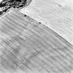 Dalachy Quarry, oblique aerial view, taken from the NNE, centred on the cropmarks of a souterrain and a possible unenclosed settlement.