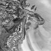 Oblique aerial view of Kinghorn centred on Pettycur harbour, taken from the WNW.