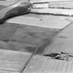 Oblique aerial view centred on the cropmarks of coal pits, taken from the NE.