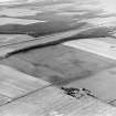 Oblique aerial view centred on the cropmarks of coal pits, taken from the NE.