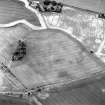 Kaim Plantation, oblique aerial view, taken from the SE, showing the cropmarks of field boundaries in the top centre of the photograph.