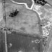 Kaim Plantation, oblique aerial view, taken from the ESE, showing the cropmarks of field boundaries in the top centre of the photograph.