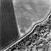Pardivan, oblique aerial view, taken from the E, centred on the cropmark of an enclosure.