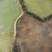 Oblique aerial view of Langlaw centred on the cropmarks of a settlement, linear cropmarks and possible unenclosed settlement, taken from the W.