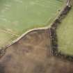 Oblique aerial view of Langlaw centred on the cropmarks of a settlement, linear cropmarks and possible unenclosed settlement, taken from the SW.