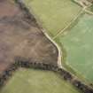 Oblique aerial view of Langlaw centred on the cropmarks of a settlement, linear cropmarks and possible unenclosed settlement, taken from the ESE.