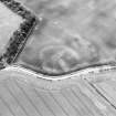 Oblique aerial view centred on the soilmarks of the settlement, taken from the N.