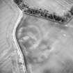 Oblique aerial view centred on the soilmarks of the settlement, taken from the WNW.