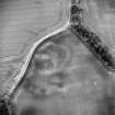 Oblique aerial view centred on the soilmarks of the settlement, taken from the WSW.