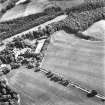 Ford, oblique aerial view, taken from the NW, centred on the cropmarks of an enclosure.