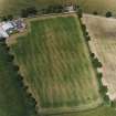 Oblique aerial view centred on the cropmarks of the Roman enclosure, taken from the SSE.