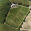 Oblique aerial view centred on the cropmarks of the Roman enclosure, taken from the ESE.