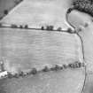 Oblique aerial view centred on the cropmarks of the Roman enclosure, taken from the WSW.