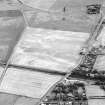 Westfield, Inveresk, oblique aerial view, taken from the NNW, centred on the cropmarks of the N terminal of the cursus monument. Cropmarks of a field-system are visible in the bottom half of the photograph.