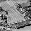 Oblique aerial photograph of Inveresk, taken from the N, centred on the cropmarks of a field system.
