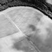 Oblique aerial view centred on the cropmarks of the pit-alignment, palisaded settlement, ring-ditches and enclosures, taken from the W.